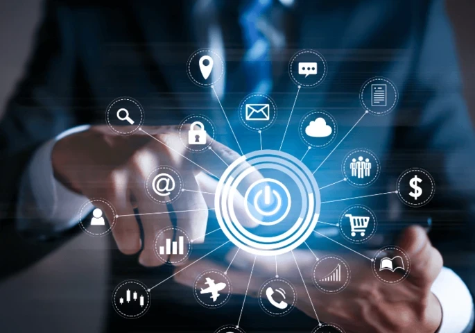 A businessman holding a tablet surrounded by various business-related logos/icons