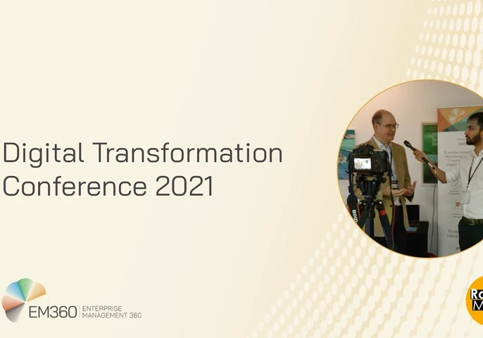 Image of a person interviewing another at the Digital Transformation Conference 2021.