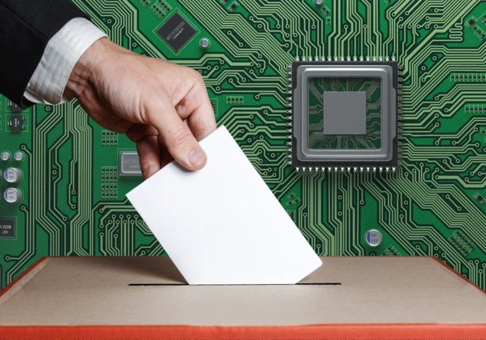 A hand placing a paper into a ballot box against a circuit board background.