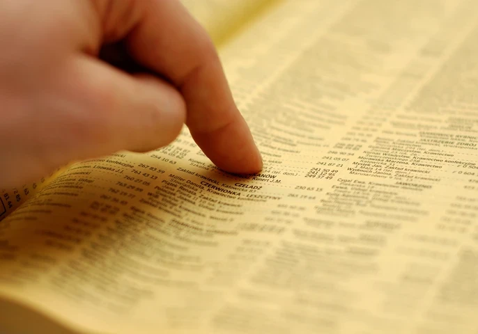 Hand pointing at a directory.