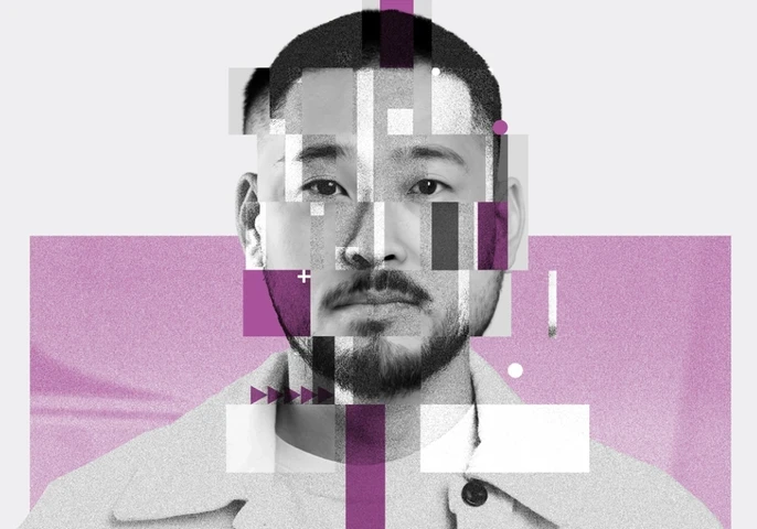 A head-on picture of a man with fractured blocks around his face.