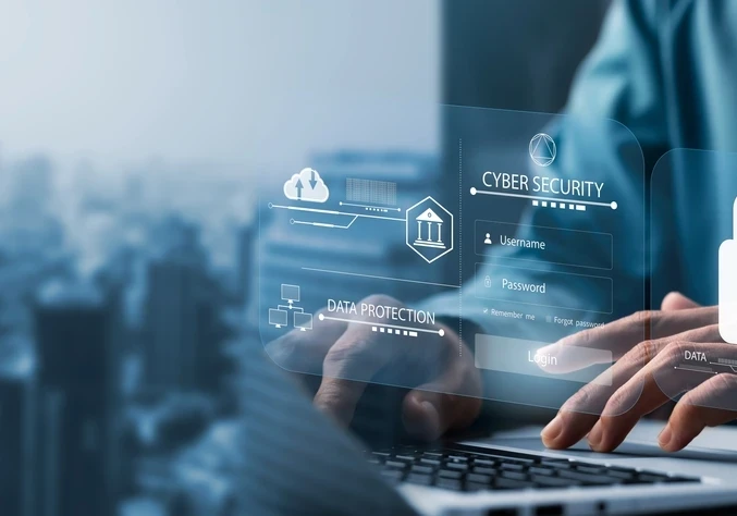 Woman typing on a laptop 