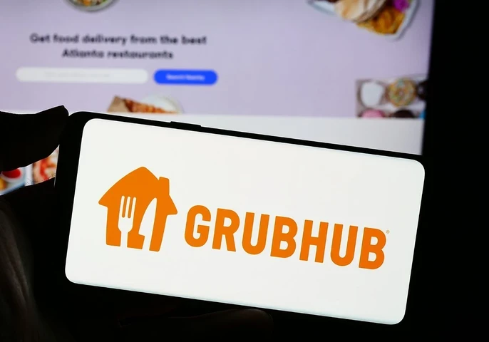 The GrubHub orange logo on a smartphone screen.