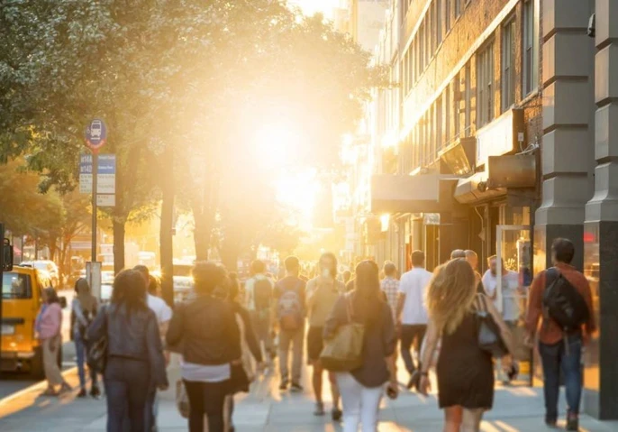 People walking on a busy street in a city