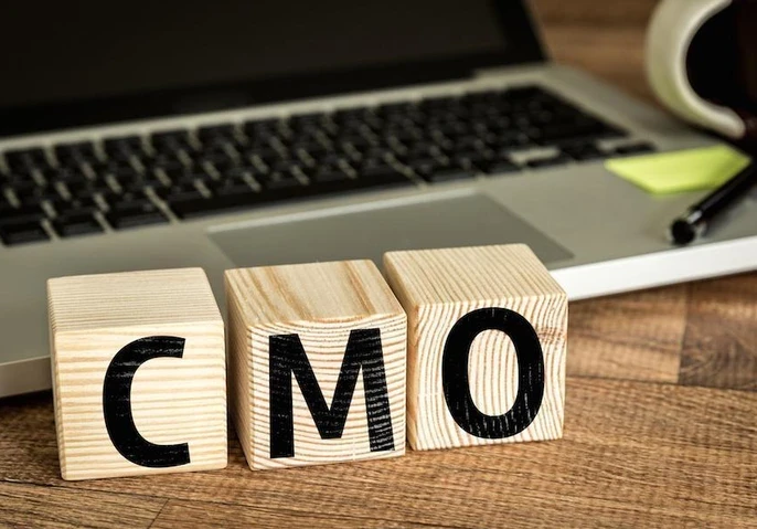 wooden blocks spelling out CMO