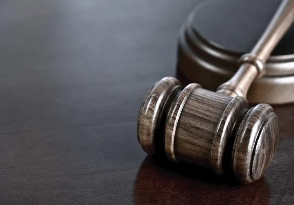 Close-up of a gavel on a wooden table