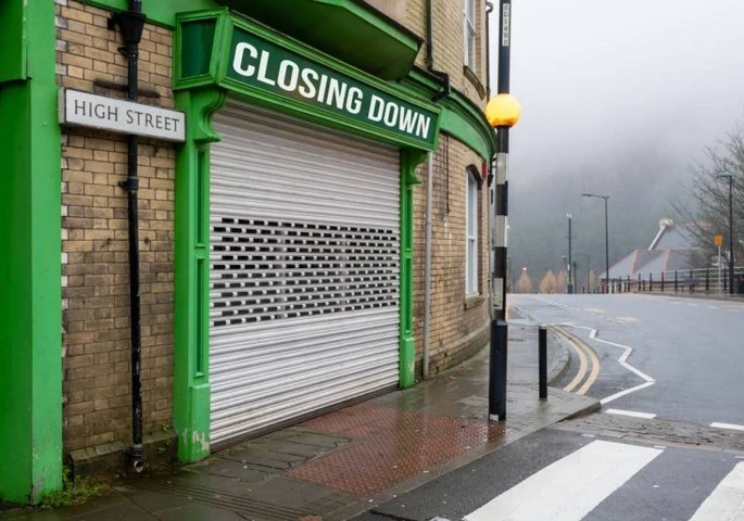 shopfront with a closing down sign