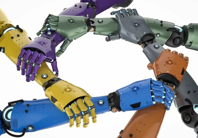 Colourful robotic arms interlinking together in a star shape.