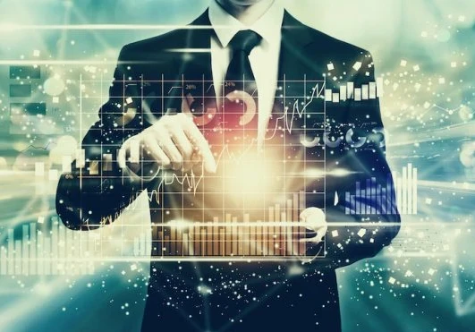 A person working on a graph showing high tech spending