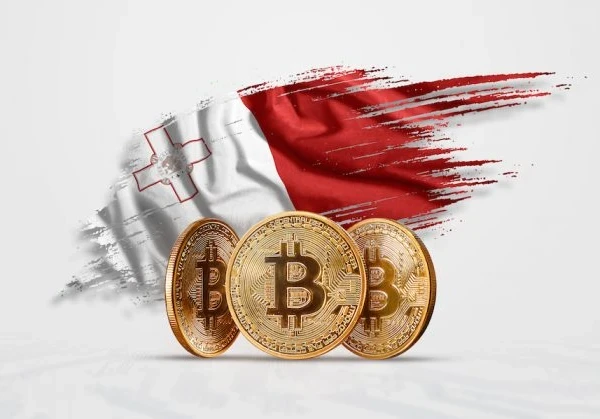 Malta flag with three Bitcoin gold coins in front of the flag