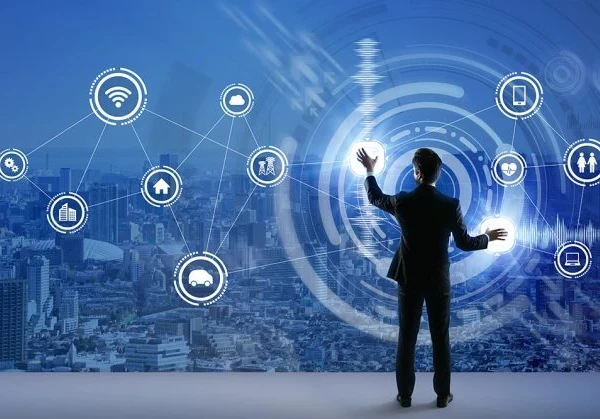 A businessman manipulating cloud-related icons on a see-through screen with a city landscape in the background.