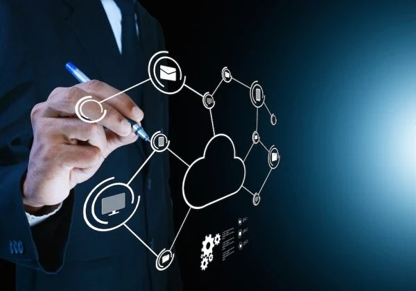 Person writing on a board showing cloud infrastructure