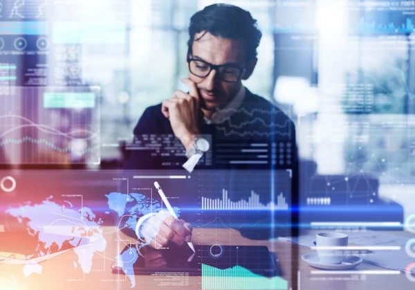 A person working on a tablet with data insights charts overlaid in pastel neon colours