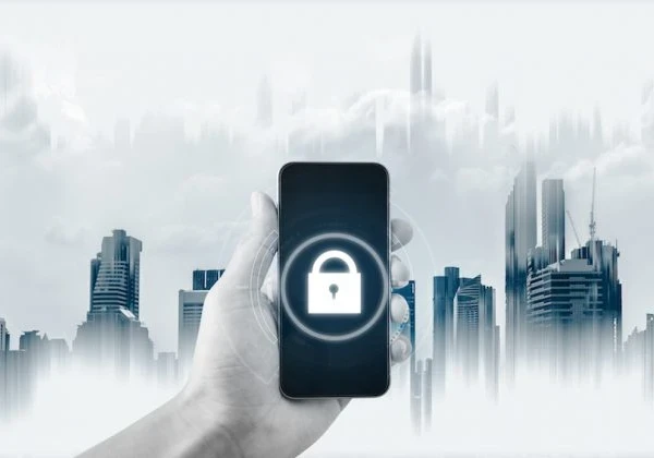 Padlock on a smartphone screen with a cityscape behind the phone