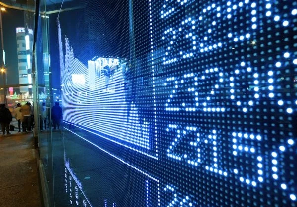 Stocks showing on a screen with visual numbers showing the stock data next to it