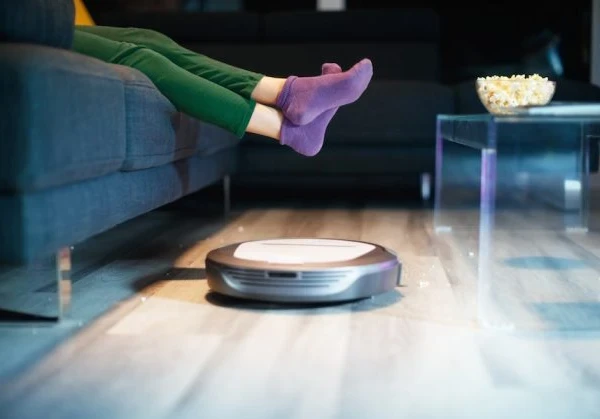roomba cleaning the floor of a home