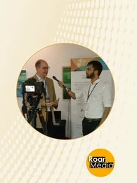 Image of a person interviewing another at the Digital Transformation Conference 2021.
