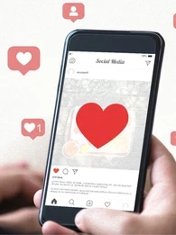 Person liking a post on Instagram with icons floating all around.