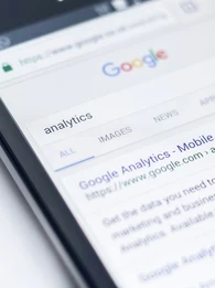Google search result for "analytics" displayed on a smartphone screen.