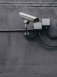 https://unsplash.com/photos/two-bullet-surveillance-cameras-attached-on-wall-yekGLpc3vro?utm_content=creditShareLink&utm_medium=referral&utm_source=unsplash