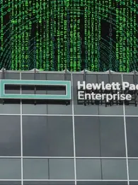hpe is investigating a cybersecurity breach after a hacker claimed data theft. Photo depicts HPE office with a backdrop of numbers going in circles to indicate cyber threat