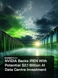 EM360Tech header graphic showing a large AI data centre corridor with rows of illuminated server racks stretching into the distance beneath a dramatic storm-filled sky glowing green and blue. Overlaid white text reads: “NVIDIA Backs IREN With Potential $2.1 Billion AI Data Centre Investment.”