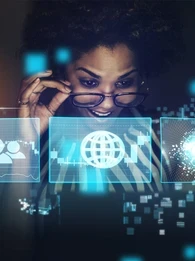 Header graphic for an EM360Tech article titled “What Is the Digital Divide Today?” with the subtitle “We explain what the digital divide means today and why digital participation now matters as much as internet access.” The image shows a woman looking through glowing blue digital interface panels with icons for users, global connectivity and data, with the EM360 Enterprise Management 360 logo at the top.