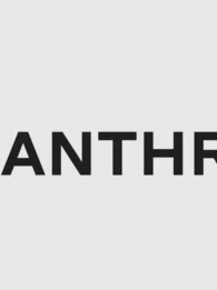 Anthropic logo displayed on a screen alongside AI-themed graphics, illustrating the company's proposed IPO and growing role in the enterprise AI market.