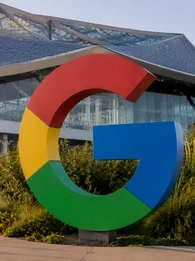 Header graphic for an EM360Tech news article titled "Google Reshuffles AI Leadership as Demis Hassabis Steps Into New Chief Scientist Role", featuring the Google "G" logo outside a modern Google office building.
