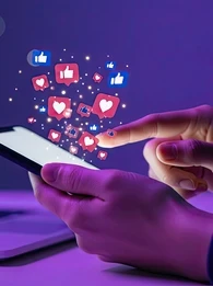 social media engagement, image of hands holding iphone with like buttons emerging out of top