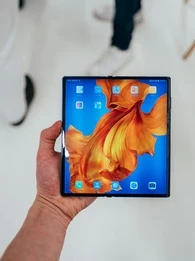 Huawei foldable smartphone Mate Xs with a colourful screen background.