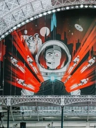Wide interior view of Olympia London beneath its white arched glass roof, featuring a huge red, black and white Big Data LDN banner with an astronaut graphic and the text “BIG DATA LDN! THE FUTURE IS INSIGHT”, alongside the 18–19 September 2024 event dates and sponsor logos.
