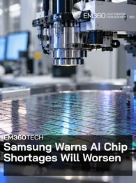 EM360Tech header graphic showing a semiconductor manufacturing facility, with a large iridescent silicon wafer beneath metallic machinery and a blurred technician in white protective clothing on the left. The image has cool blue-grey tones, with blue, green and gold reflections on the wafer. A white EM360 Enterprise Management 360 logo appears at the top right. Large white text reading “EM360TECH” and “Samsung Warns AI Chip Shortages Will Worsen” overlays the lower half on a semi-transparent black rectangle