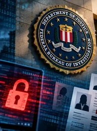 A hacker sitting in front of a screen with the FBI logo in the background.