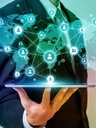 A person holding a tablet with a map of the world on it