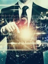 A person working on a graph showing high tech spending