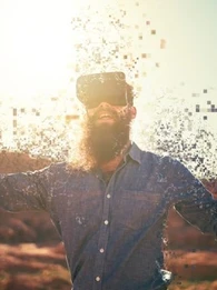 A person wearing a VR headset as if they are becoming part of the virtual world