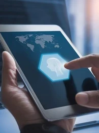 person using a tablet featuring a person sketch showing artificial intelligence