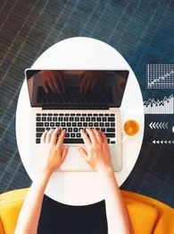 Birdseye view of someone working on a laptop