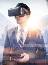 A businessman wearing virtual reality glasses and handling a smartphone against a cityscape.