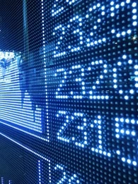 Stocks showing on a screen with visual numbers showing the stock data next to it