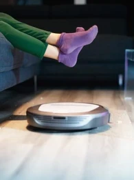 roomba cleaning the floor of a home