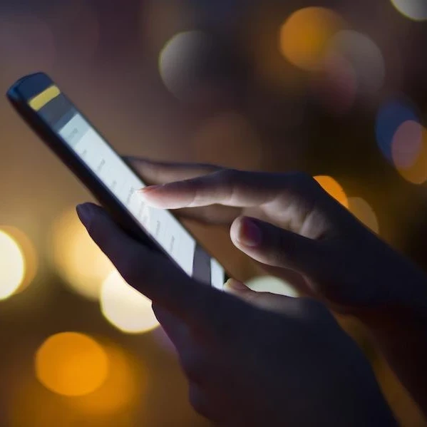 Person using a smartphone while outside