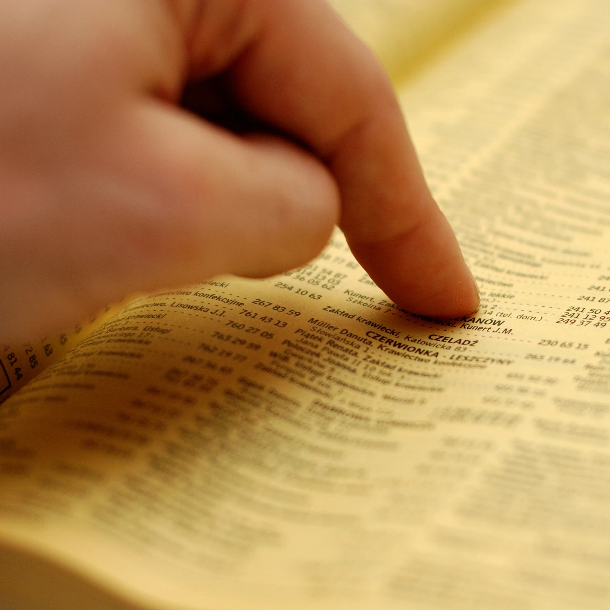 Hand pointing at a directory.