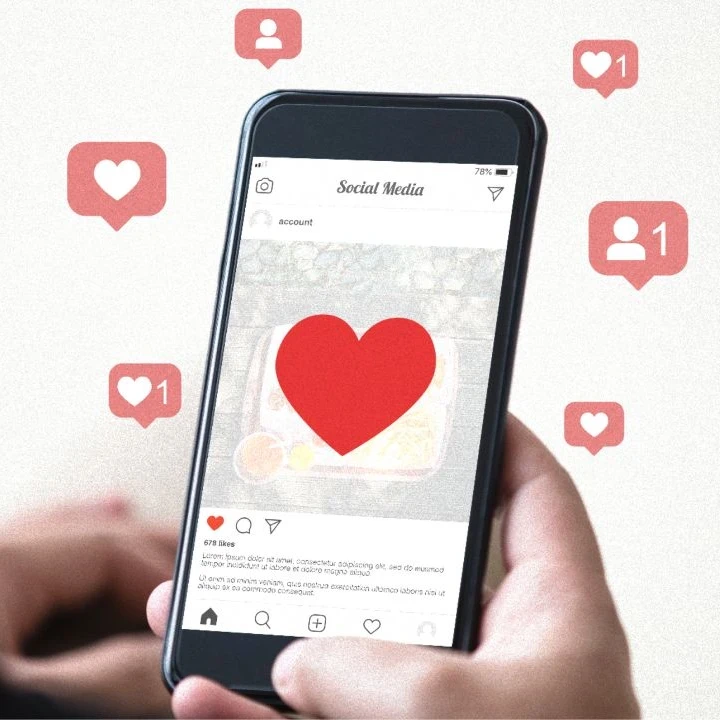 Person liking a post on Instagram with icons floating all around.