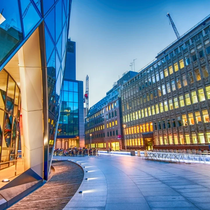 A view of a UK business district at dusk.
