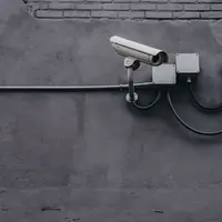 https://unsplash.com/photos/two-bullet-surveillance-cameras-attached-on-wall-yekGLpc3vro?utm_content=creditShareLink&utm_medium=referral&utm_source=unsplash