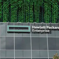 hpe is investigating a cybersecurity breach after a hacker claimed data theft. Photo depicts HPE office with a backdrop of numbers going in circles to indicate cyber threat