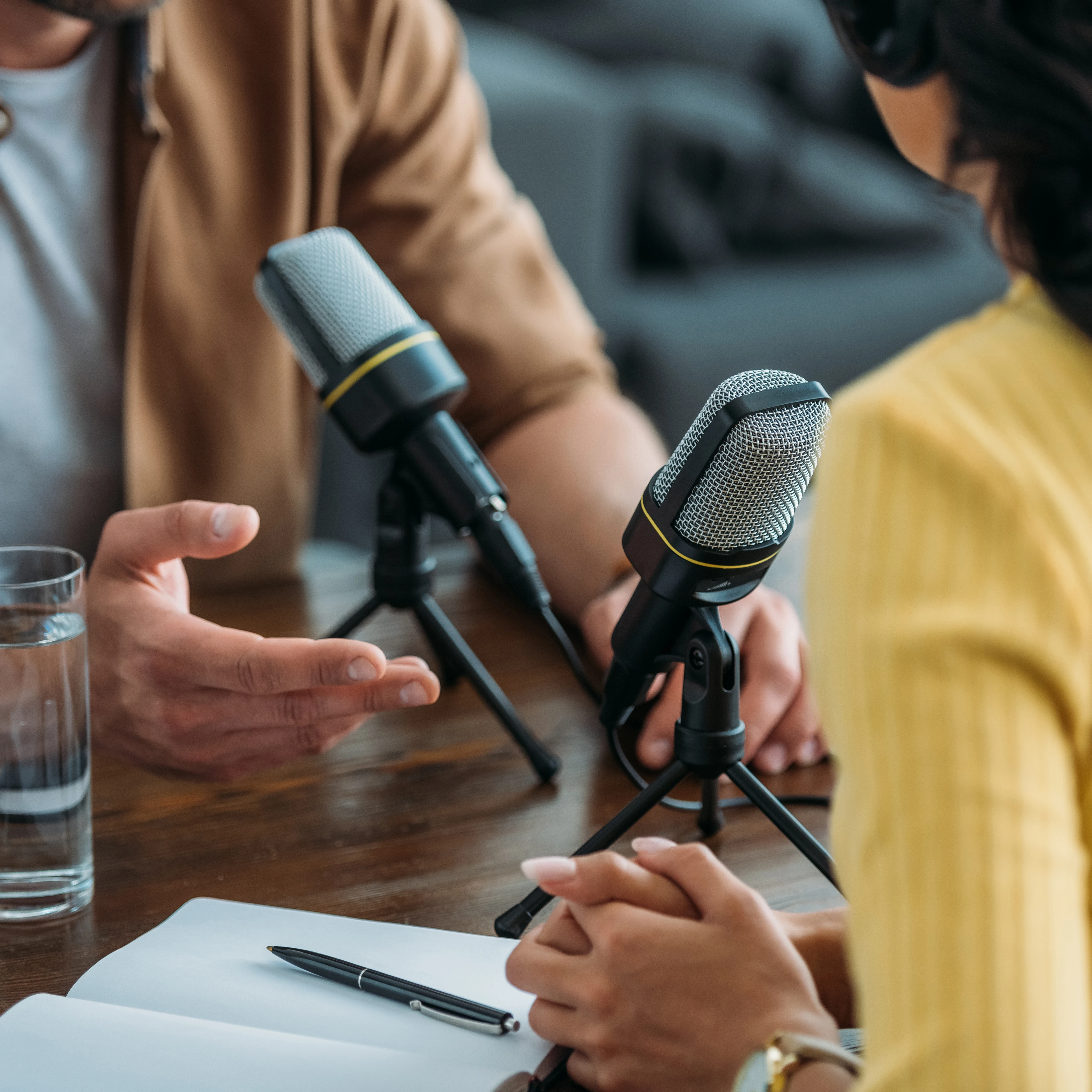 Two people recording a podcast
