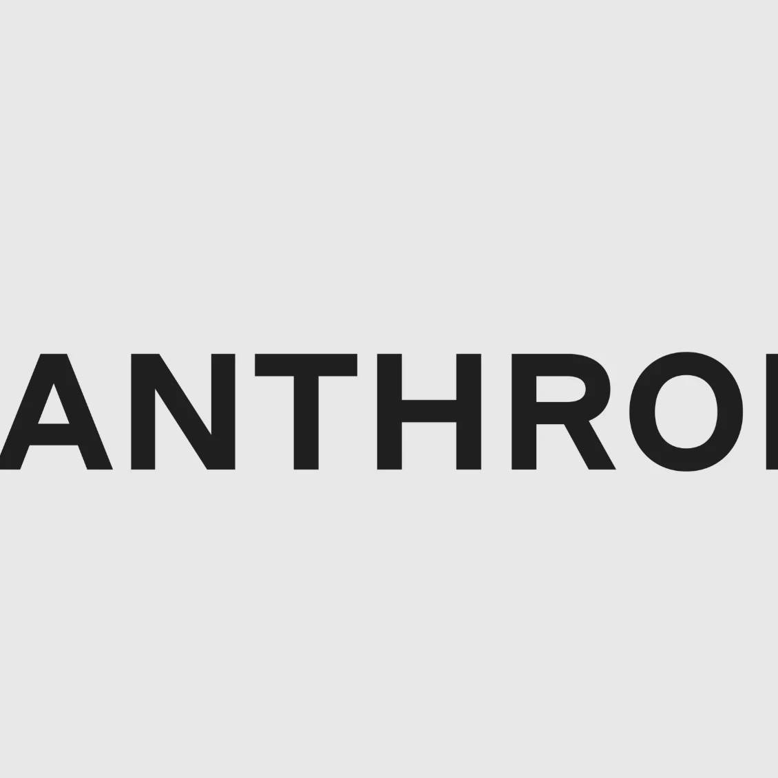 Anthropic logo displayed on a screen alongside AI-themed graphics, illustrating the company's proposed IPO and growing role in the enterprise AI market.